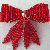 red ribbon brooch